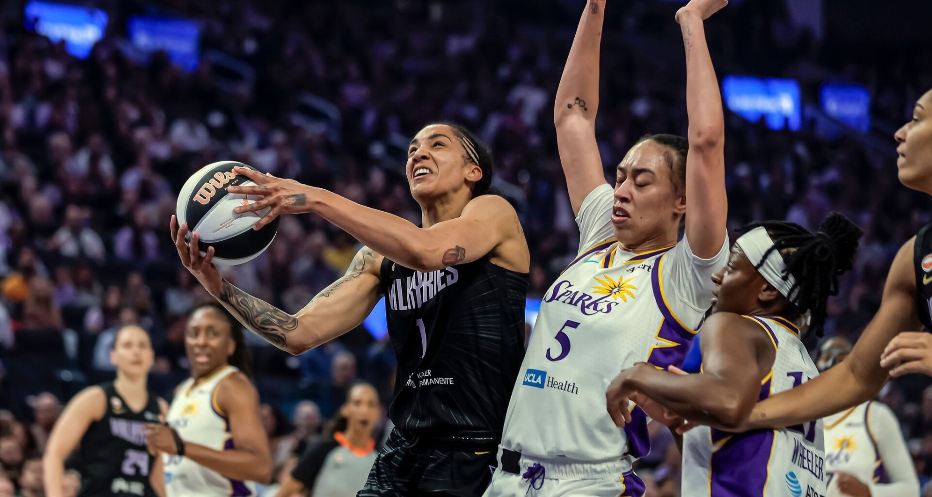 Golden State Valkyries' Gabby Williams (1) drives to the basket in the first half of a WNBA basketball game against the Los Angeles Sparks, Monday, June 15, 2026, in San Francisco. (Carlos Avila Gonzalez/San Francisco Chronicle via AP)