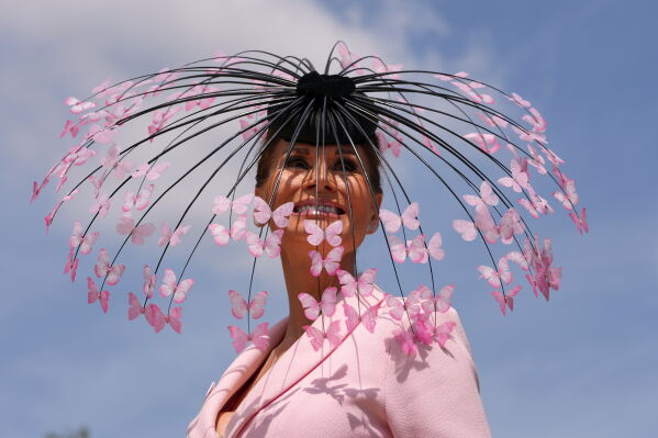 Racegoer Isabell Kristensen poses for photographers on the first day of the Royal Ascot horse race meeting in Ascot, England, Tuesday, June 16, 2026.(AP Photo/Kin Cheung)
