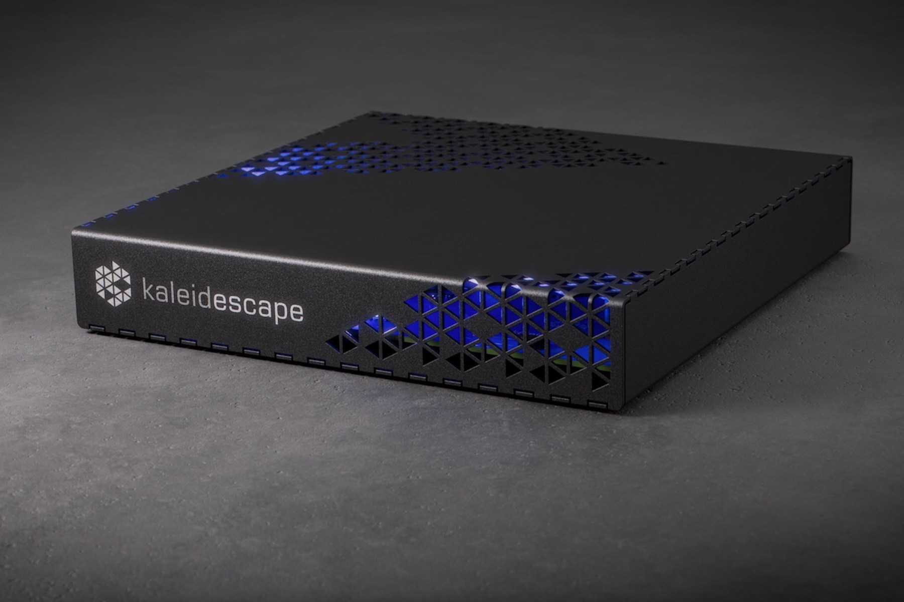 The Kaleidescape Strato E player on a gray surface.