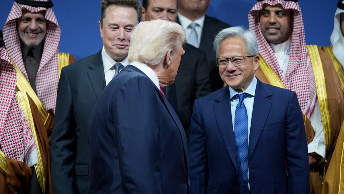 President Donald Trump speaking with Elon Musk and Nvidia CEO Jensen Huang at the Saudi Investment Forum