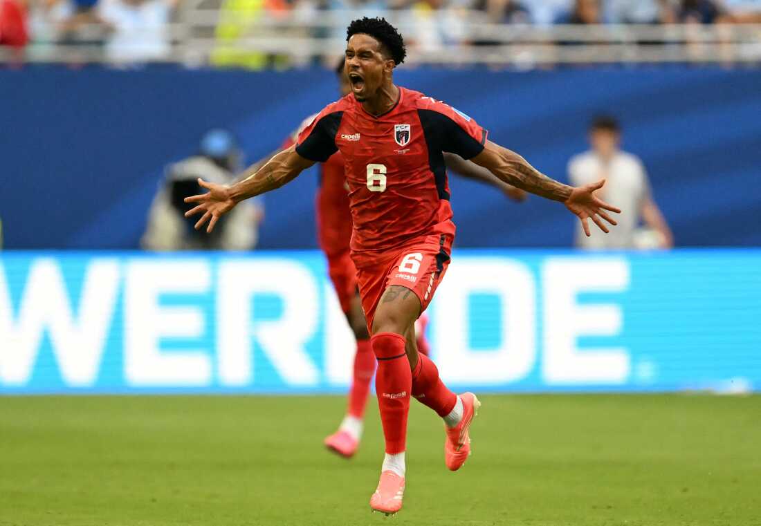 Cape Verde's midfielder Kevin Pina celebrates after scoring his team's first goal during a World Cup match against Uruguay in Miami Gardens, Fla., on Sunday. Cape Verde played Uruguay to a 2-2 draw.