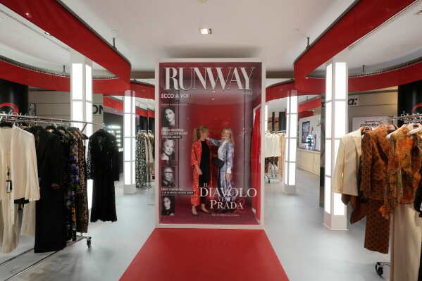 Visitors enjoy an installation of the new movie 'The Devil Wears Prada 2' at La Rinascente shopping center, in Milan, Italy, Monday, April 20, 2026. (AP Photo/Luca Bruno)