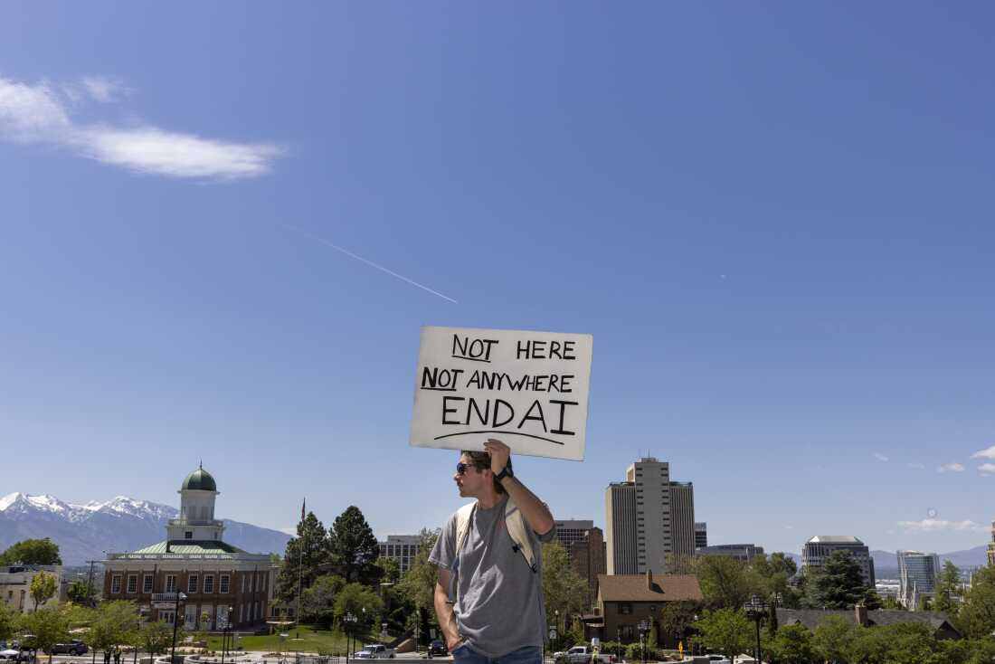 Scott Kwiatkowski from takes part in a demonstration at the Utah State Capitol to oppose the construction of a data center in the state on May 23, 2026 in Salt Lake City, Utah. Support and opposition to artificial intelligence is drawing tens of millions of dollars of spending during the midterm election cycle.