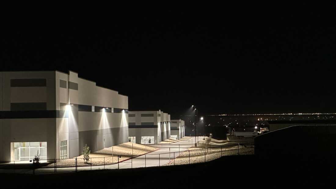 A massive 826,780-square-foot warehouse sits illuminated Feb. 12, 2026, in the El Paso suburb of Socorro, Texas, that was recently purchased by the U.S. Department of Homeland Security for $122.8 million.