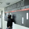 A federal officer stands in a hallway at New York Federal Plaza Immigration Court inside the Jacob K. Javitz Federal Building in New York in October 2025.