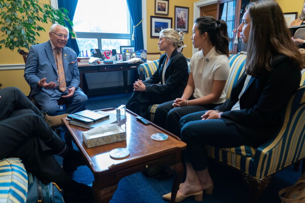 Rep. Paul Tonko, D-N.Y., speaks with Olympians Jessie Diggins, from center left, Bea Kim and Julia Kern, during a meeting to advocate for clean air, clean water and a healthy planet on Capitol Hill Tuesday, June 23, 2026, in Washington. (AP Photo/Jose Luis Magana)