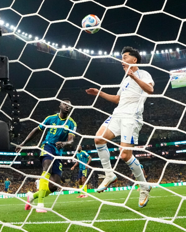 Uzbekistan's Abbosbek Fayzullaev scores his team's first goal during the World Cup Group K soccer match between Uzbekistan and Colombia in Mexico City, Wednesday, June 17, 2026. (AP Photo/Natacha Pisarenko)