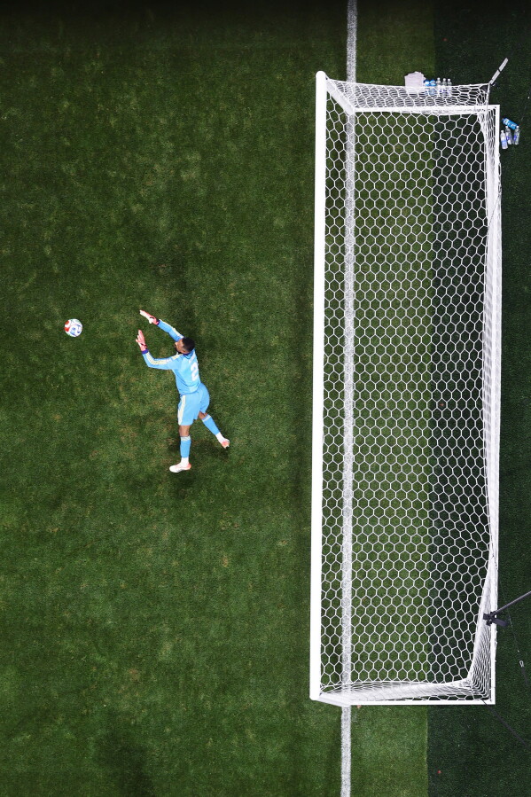 Saudi Arabia goalkeeper Nawaf Alaqidi (1) makes a save during the World Cup Group H soccer match between Spain and Saudi Arabia in Atlanta, Sunday, June 21, 2026. (AP Photo/Colin Hubbard)