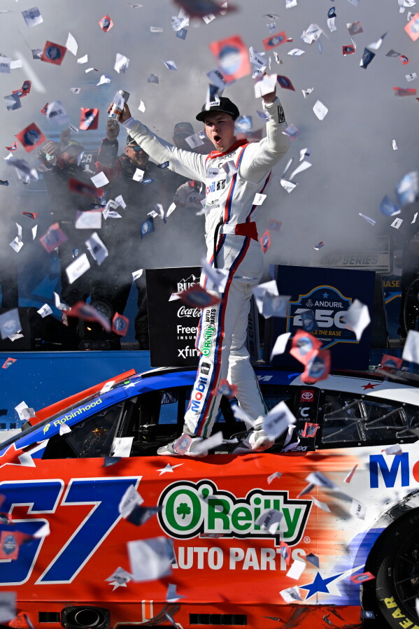 Cory Heim celebrates in Victory Lane after winning a NASCAR Cup Series auto race, Sunday, June 21, 2026, in Coronado, Calif. (AP Photo/Denis Poroy)