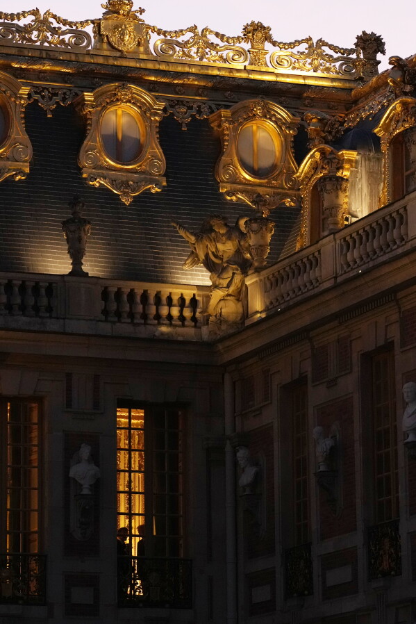 President Donald Trump and French President Emmanuel Macron are silhouetted inside the Palace of Versailles, Wednesday, June 17, 2026, in Versailles, France. (AP Photo/Julia Demaree Nikhinson)