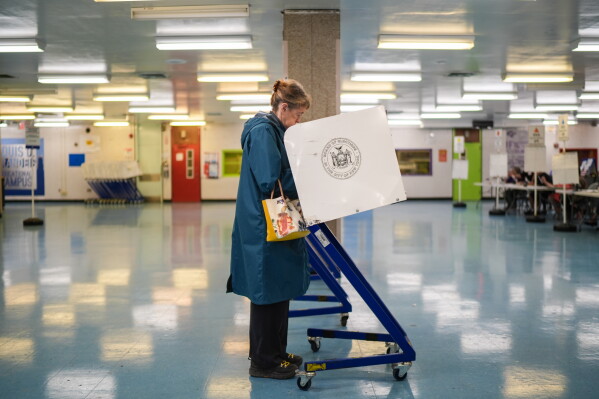 A voter casts a ballot during New York’s primary election on Tuesday, June 23, 2026, in New York. (AP Photo/Ryan Murphy)