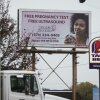 A billboard in South Bend, Indiana, advertises a crisis pregnancy center in 2021. The sign reads, "Free pregnancy test" "Free ultrasound" and "Walk ins welcome."