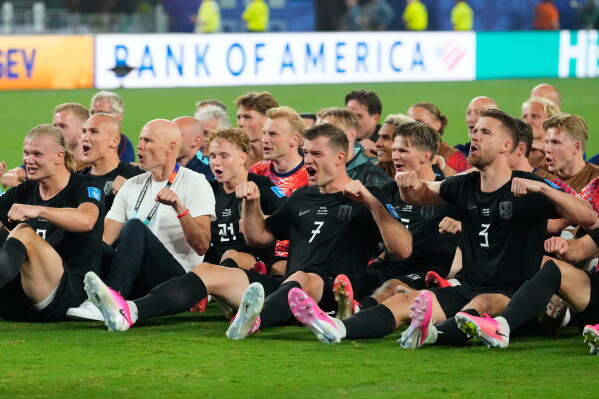Norwegian players Erling Haaland, left, Alexander Soerloth (7), Kristoffer Ajer (3) and teammates celebrate after defeating Senegal in a World Cup Group I soccer match in East Rutherford, N.J., near New York, Monday, June 22, 2026. (AP Photo/Yuki Iwamura)