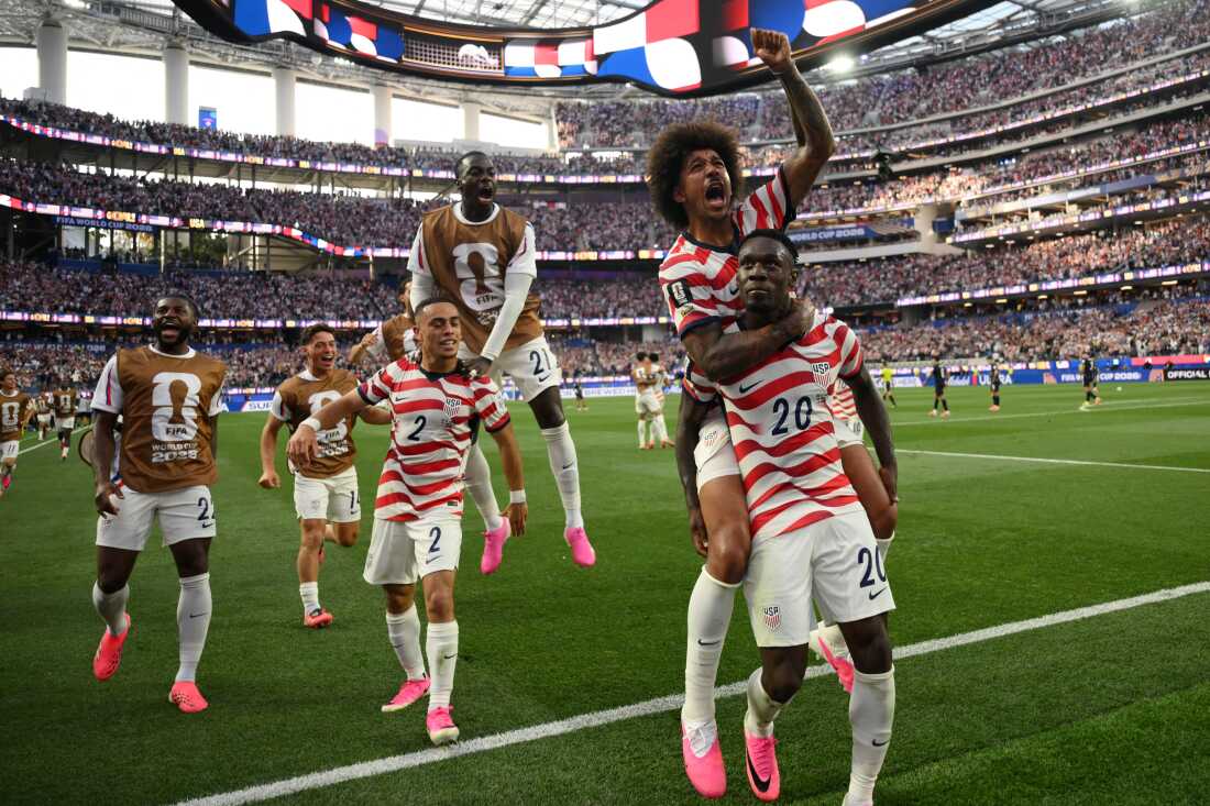 U.S. forward #20 Folarin Balogun celebrates with teammates after scoring his team's third goal during their opening World Cup group match against Paraguay in Inglewood, Calif. on June 12, 2026.