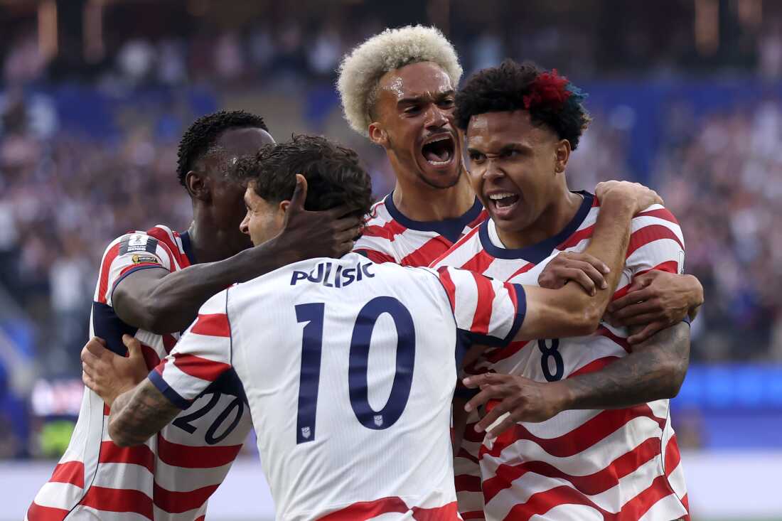 U.S. players celebrate during their World Cup group match against Paraguay.