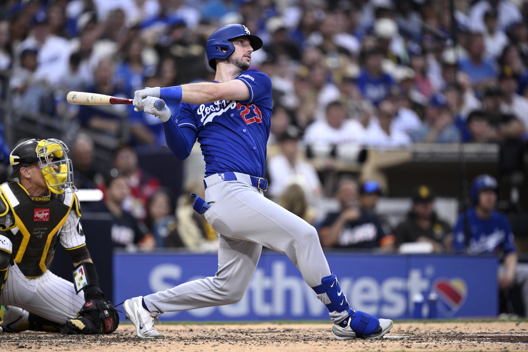 Kyle Tucker hits a two-run home run against the San Diego Padres on Saturday in the Dodgers' 15-3 win.
