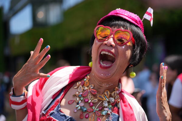 A tennis supporter cheers during the first day of the Wimbledon Tennis Championships in London, Monday, June 29, 2026.(AP Photo/Kin Cheung)