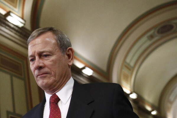 In this Jan. 29, 2020, file photo Chief Justice John Roberts departs at the end of the day in the impeachment trial of President Donald Trump on charges of abuse of power and obstruction of Congress on Capitol Hill in Washington. (AP Photo/Patrick Semansky, File)