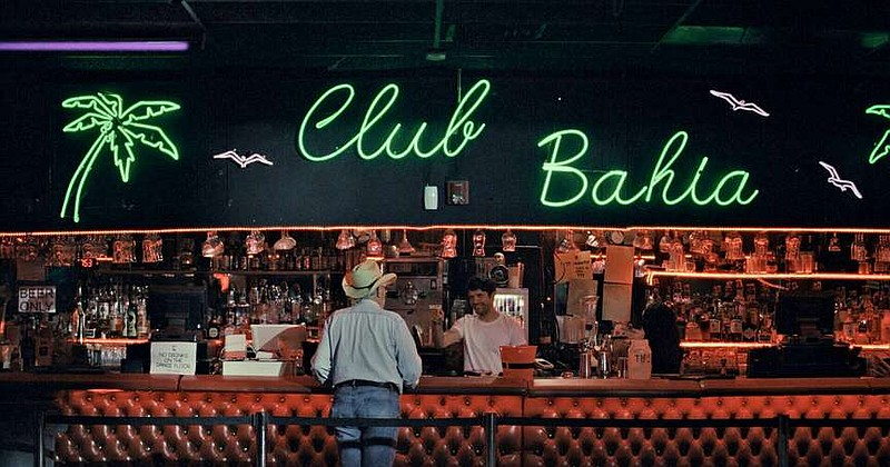 A man stands at the bar at Club Bahaia in this still from Stud Country, one of eight documentary shorts to be shown at the Arkansas School for Mathematics, Sciences, and the Arts tonight at the final stop on the Hot Springs Documentary Film Festival's America250 Screening Series. (Courtesy HSDFF)