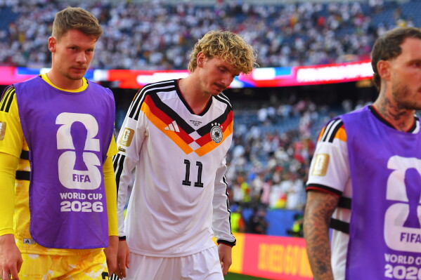 Germany's Nick Woltemade (11) walks off the field after losing to Paraguay in a shootout during the World Cup round of 32 soccer match in Foxborough, Mass., near Boston, Monday, June 29, 2026. (AP Photo/Steven Senne)