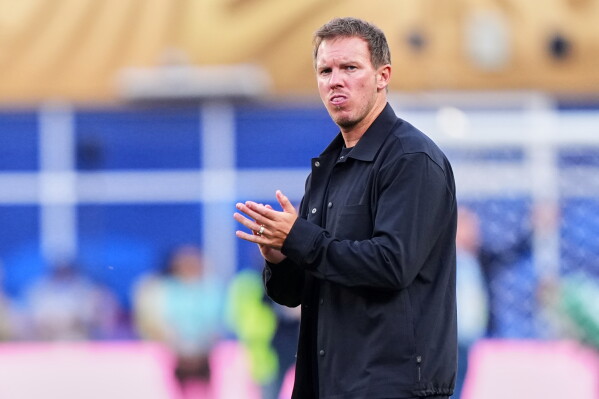 Germany head coach Julian Nagelsmann claps hands to supporters after losing the World Cup round of 32 soccer match between Germany and Paraguay in Foxborough, Mass., near Boston, Monday, June 29, 2026. (AP Photo/Martin Meissner)