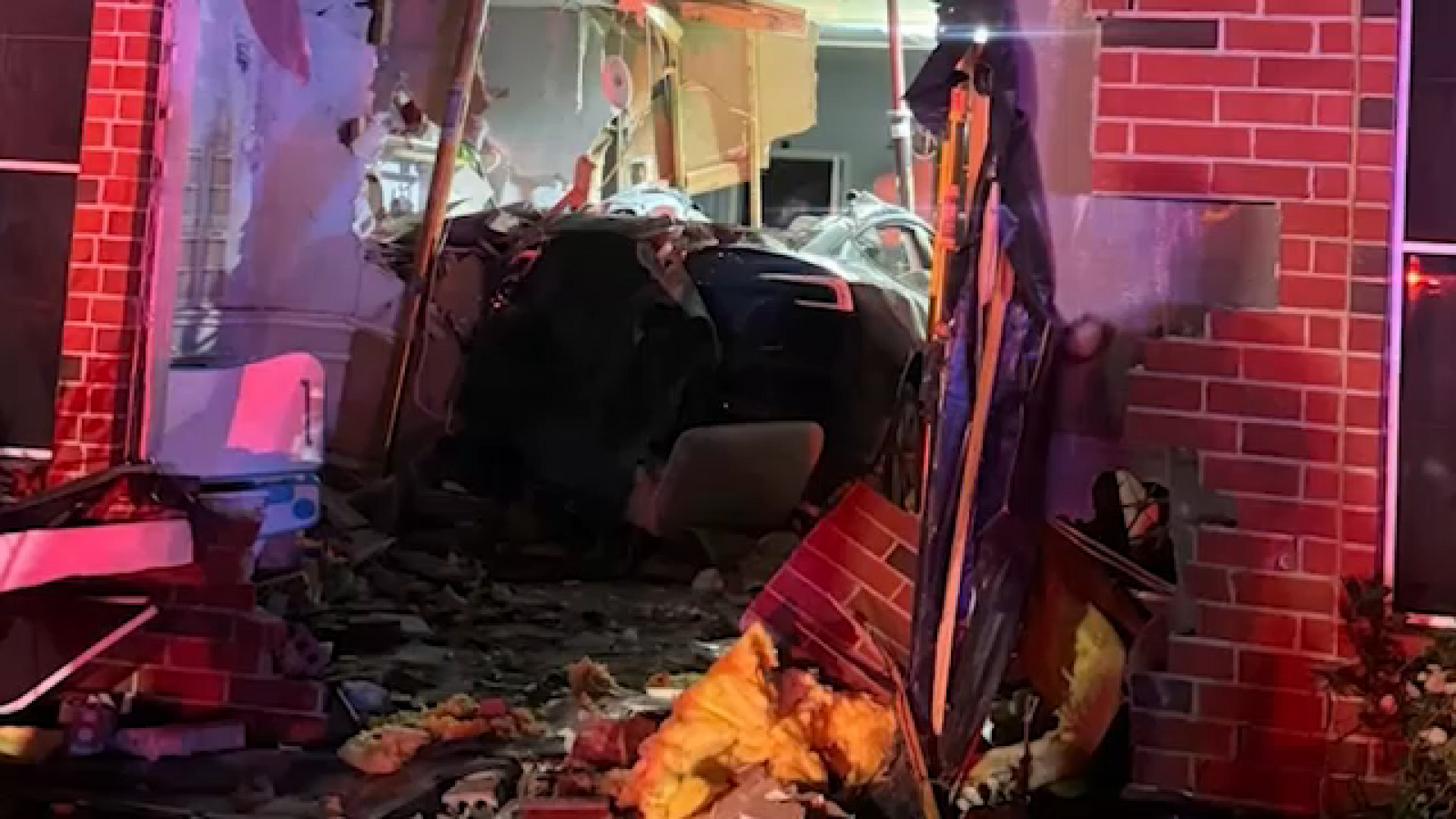 Woman killed, driver injured after Tesla crashes through Katy-area home, Harris County Sheriff's Office says