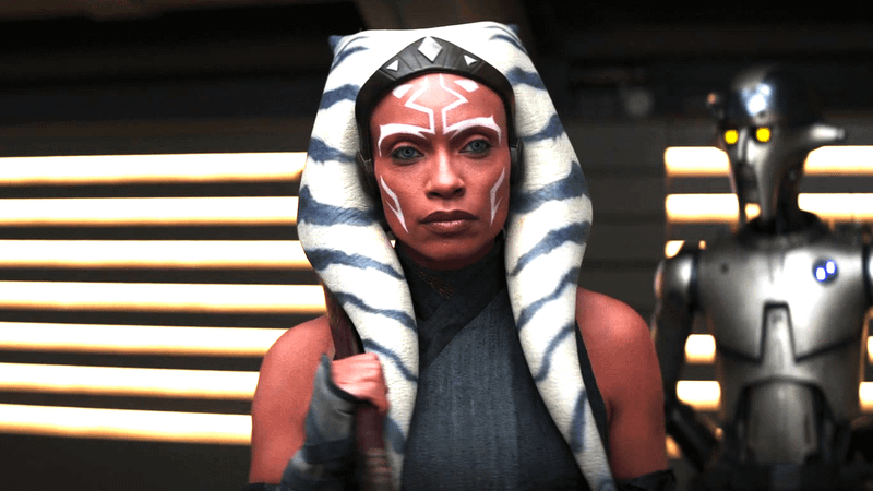 Rosario Dawson as Ahsoka Tano in front of Huyang in 'Ahsoka' Season 1.