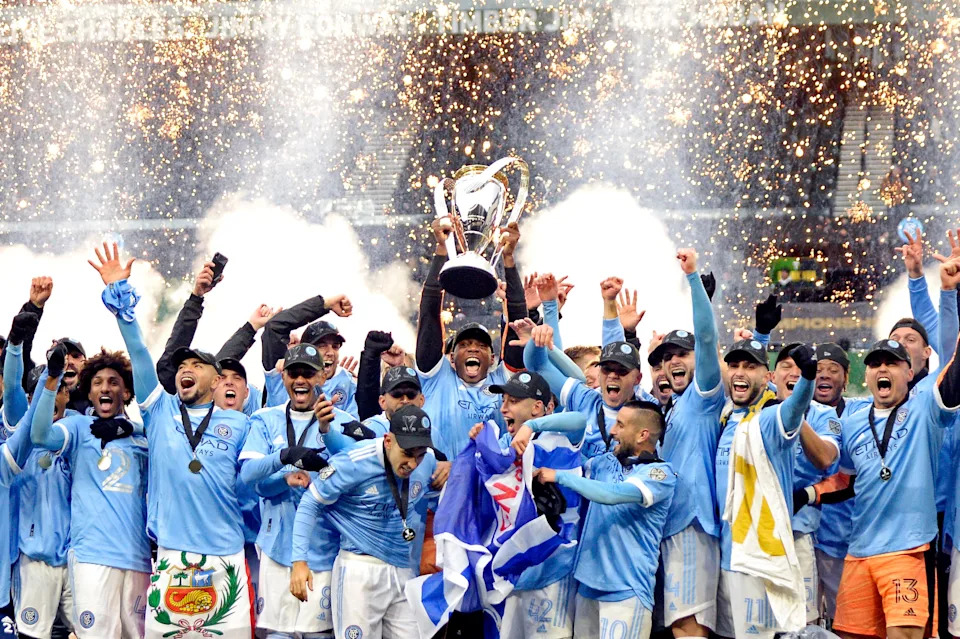 NYCFC celebrates with the MLS Cup trophy.