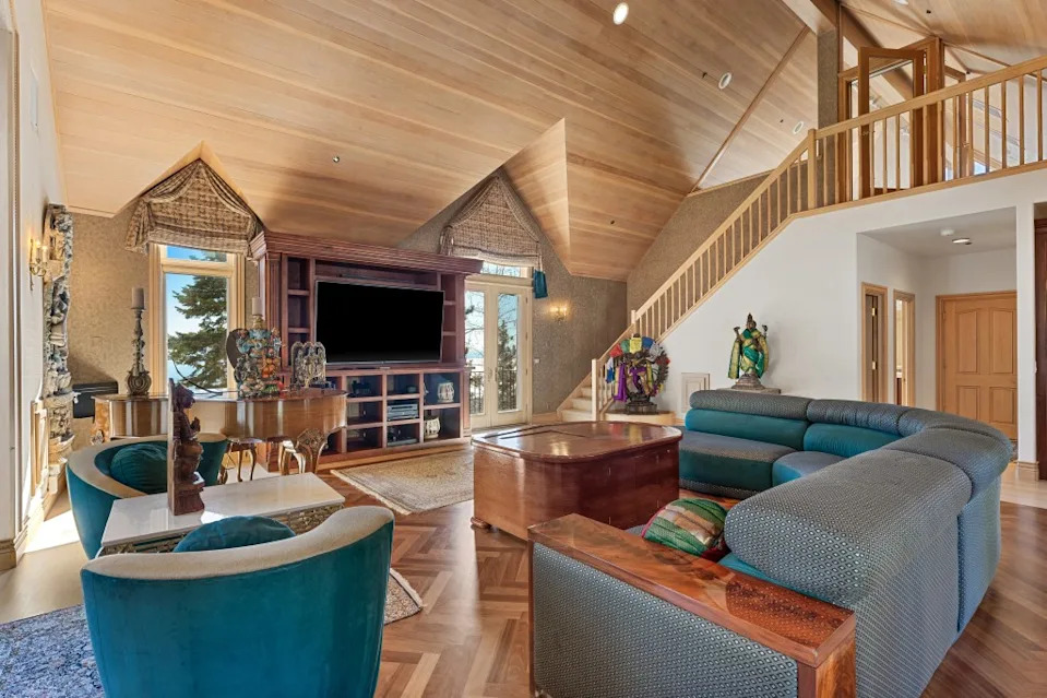 The luxurious estate has a whopping 10 bedrooms, 12 bathrooms, and 3 half-bathrooms across 18,922 square feet on a 2.5-acre lot. Habitat Team