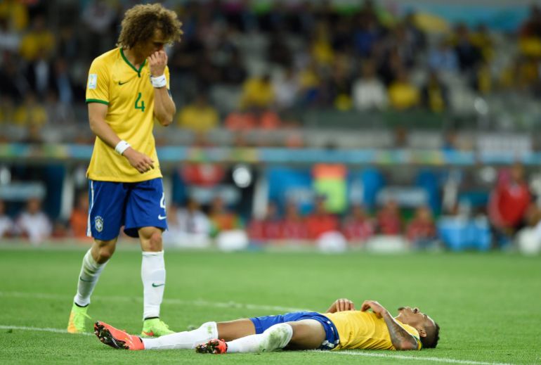 July 8, 2014; Belo Horizonte, BRAZIL; Brazil players David Luiz (4) and Luiz Gustavo (right) react after the semifinal match against Germany in the 2014 World Cup at Mineirao Stadium. Mandatory Credit: Tim Groothuis/Witters Sport via USA TODAY Sports