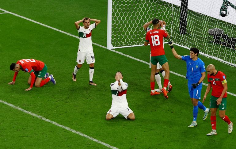 Soccer Football - FIFA World Cup Qatar 2022 - Quarter Final - Morocco v Portugal - Al Thumama Stadium, Doha, Qatar - December 10, 2022 Portugal's Cristiano Ronaldo and Morocco's Yassine Bounou react REUTERS/Paul Childs