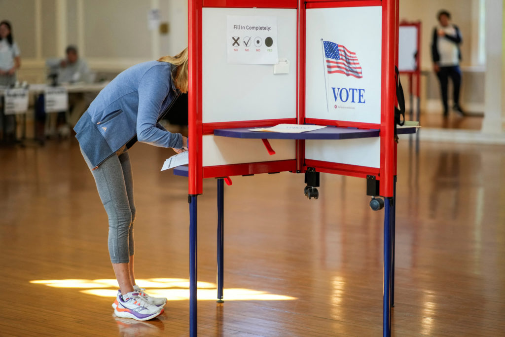 People vote during the primary election for U.S. Congress in New Jersey