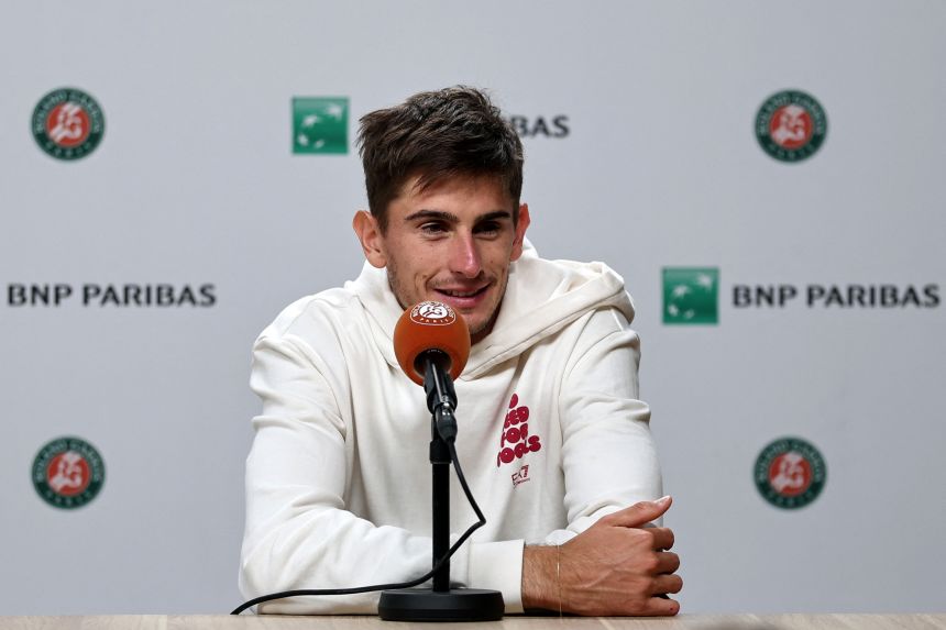 Italy's Matteo Arnaldi speaks during a press conference after withdrawing ahead of his semifinal match against Cobolli.