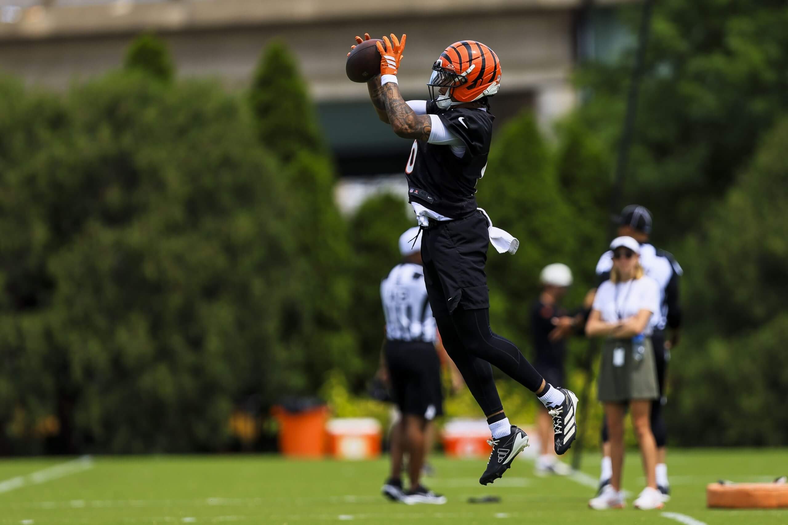 Cincinnati Bengals safety Bryan Cook (6) catches a pass during minicamp at Kettering Health Practice Fields.