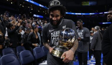 Julian Champagnie holds the NBA Western Conference Finals trophy