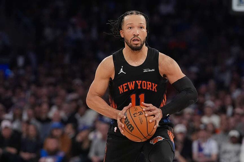 New York Knicks' Jalen Brunson (11) looks to pass during the second half of Game 2 in the Eastern Conference finals NBA basketball playoffs series against the Cleveland Cavaliers, Thursday, May 21, 2026, in New York. (AP Photo/Frank Franklin II)