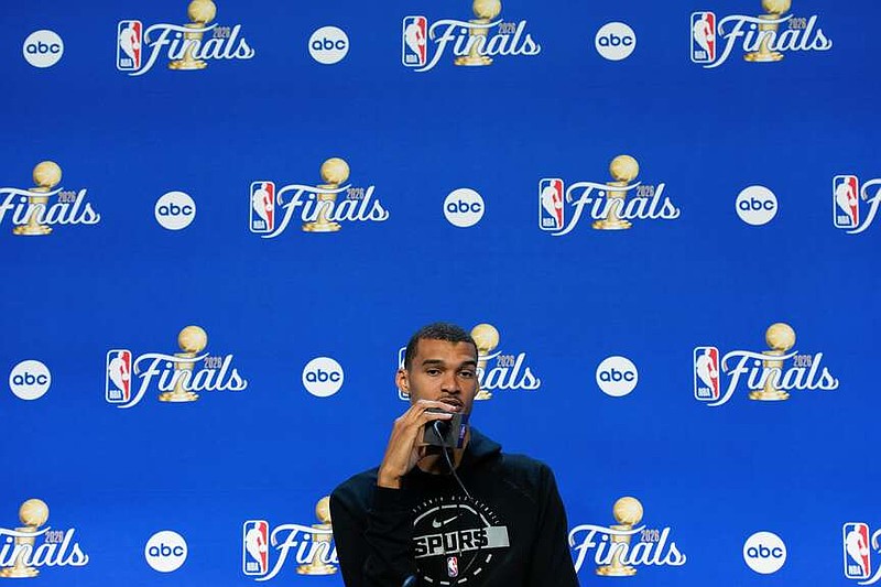 San Antonio Spurs forward Victor Wembanyama speaks during a news conference prior to Game 5 of the NBA Finals basketball series against the New York Knicks, Friday, June 12, 2026, in San Antonio. (AP Photo/Ross D. Franklin)