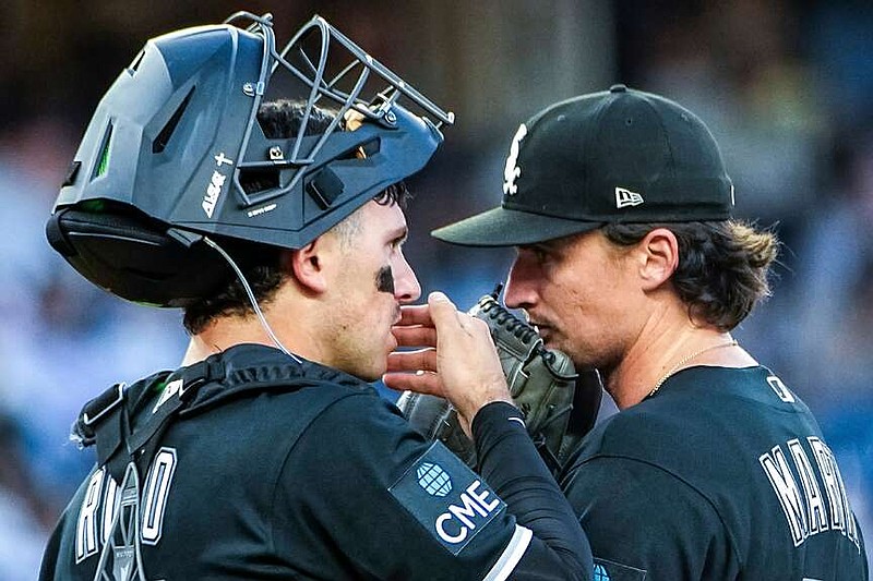 Chicago White Sox pitcher Davis Martin, right, speaks with catcher Drew Romo during the third inning of a baseball game against the New York Yankees, Tuesday, June 16, 2026, in New York. (AP Photo/Eduardo Munoz Alvarez)