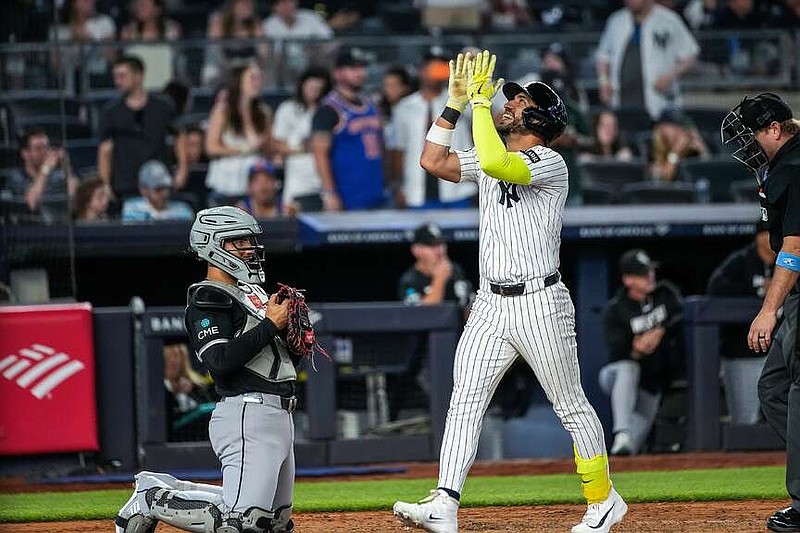 New York Yankees Jose Caballero, center celebrates a solo home run pitched by Chicago White Sox Center Field Luis angel Acuna during the eighth inning of a baseball game, Tuesday, June 16, 2026, in New York. (AP Photo/Eduardo Munoz Alvarez)