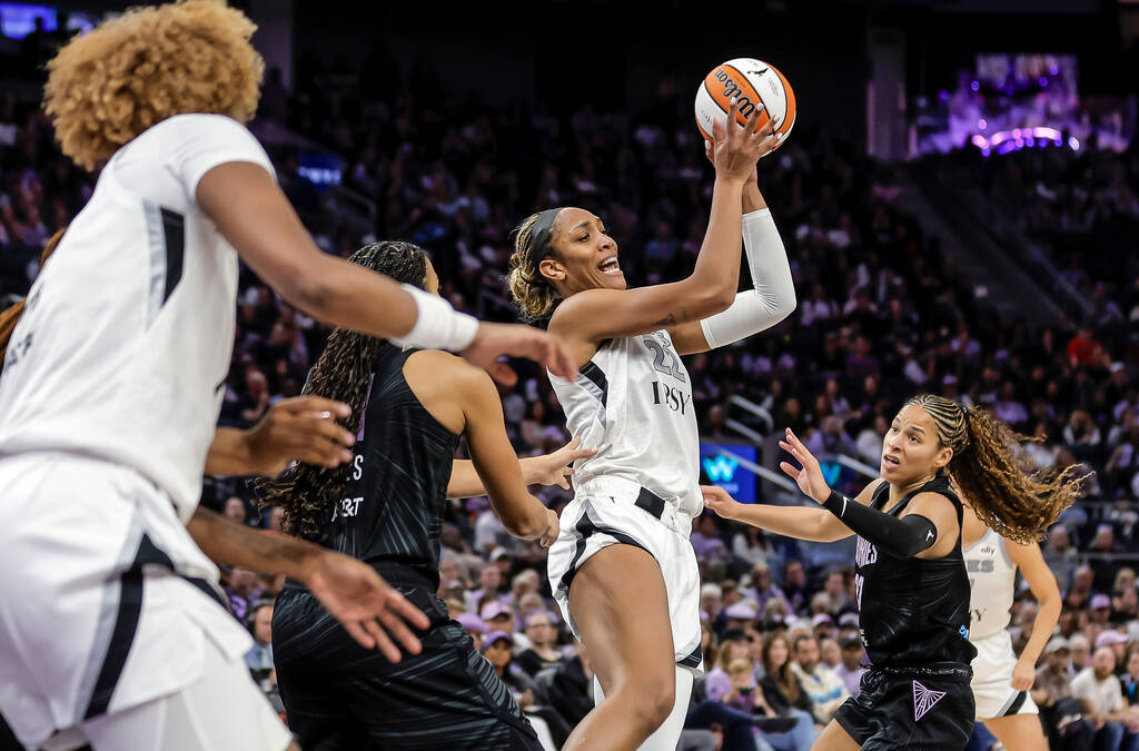 Las Vegas Aces' A'ja Wilson (22) passes to a teammate in the second half of a WNBA ba ...