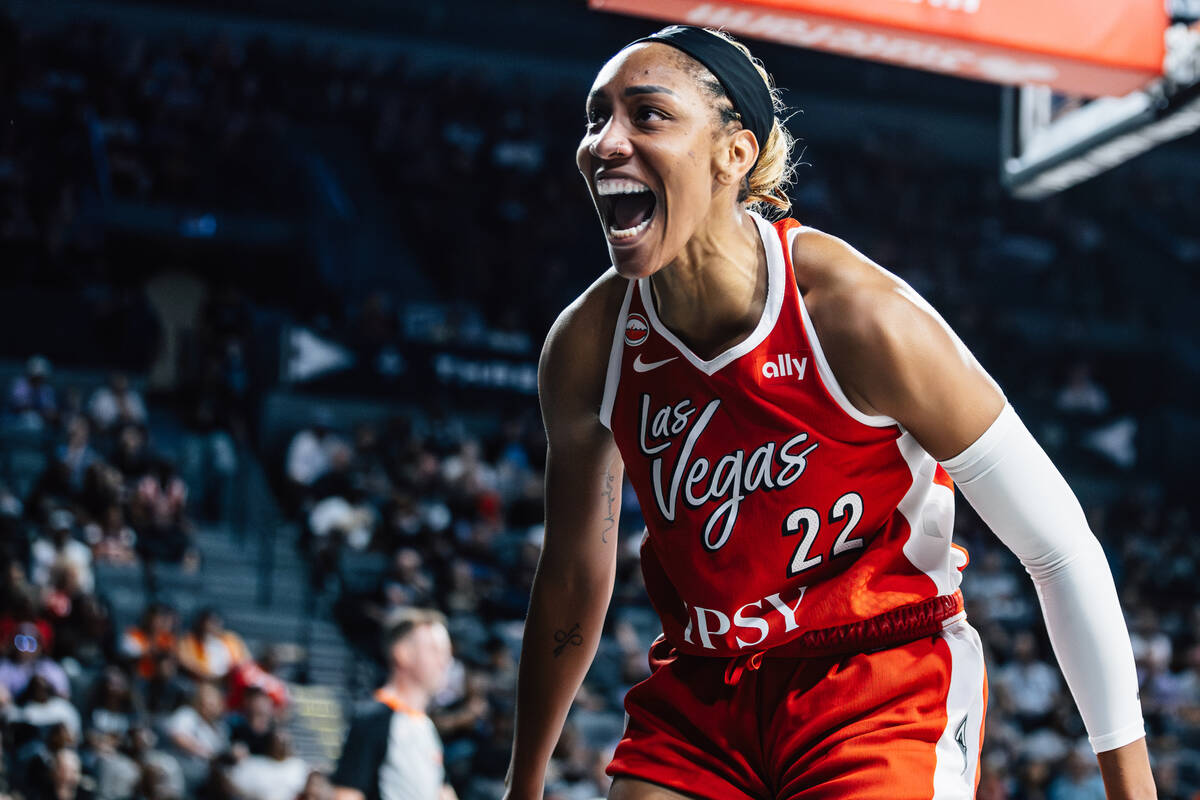 Aces center A'ja Wilson (22) celebrates being fouled on in a WNBA basketball game against ...