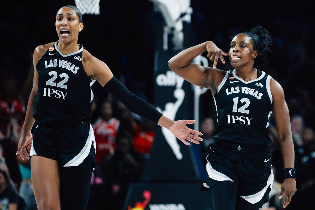Aces center A'ja Wilson (22) and Aces guard Chelsea Gray (12) react to a shot by Gray duri ...