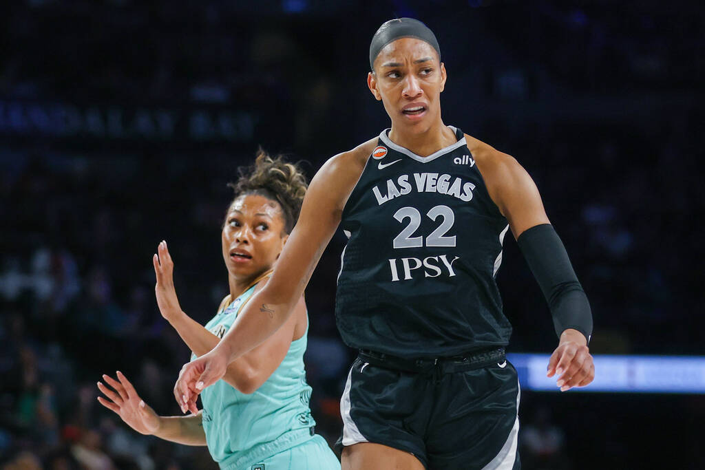 Aces center A'ja Wilson (22) and New York Liberty guard-forward Betnijah Laney-Hamilton (4 ...