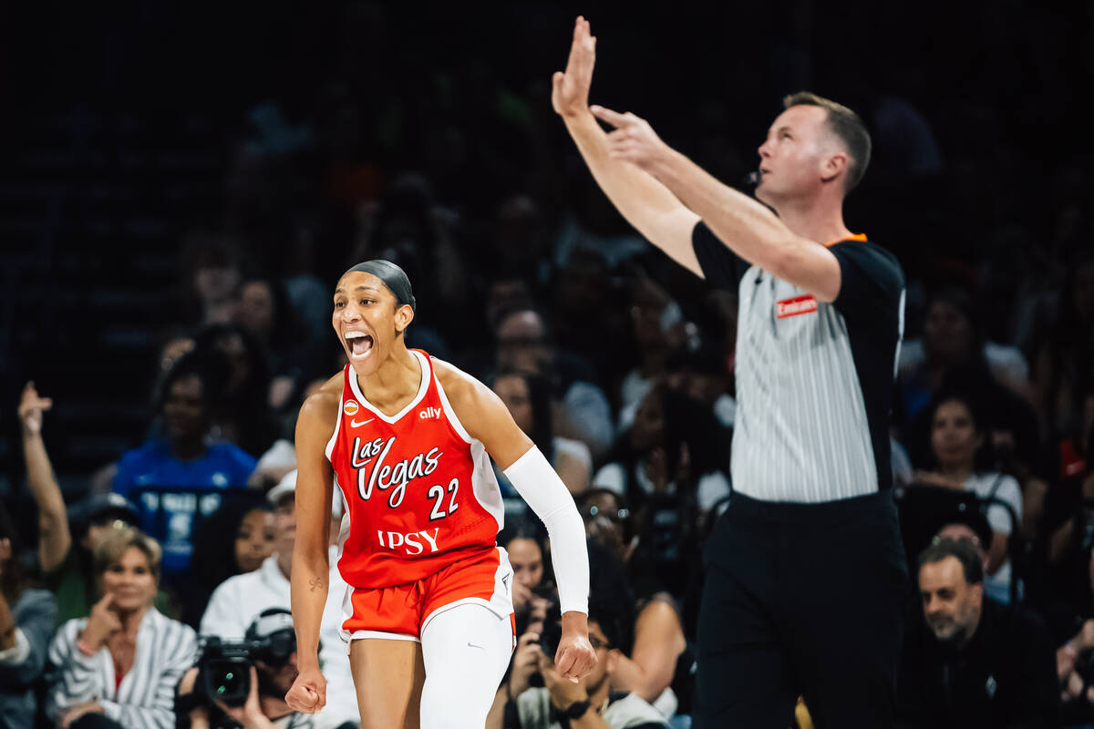 Aces center A'ja Wilson (22) celebrates a shot during a WNBA basketball game against the D ...