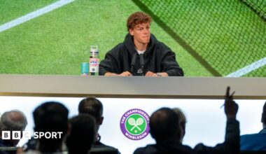 Jannik Sinner speaks at a news conference during the 2025 Wimbledon Championships