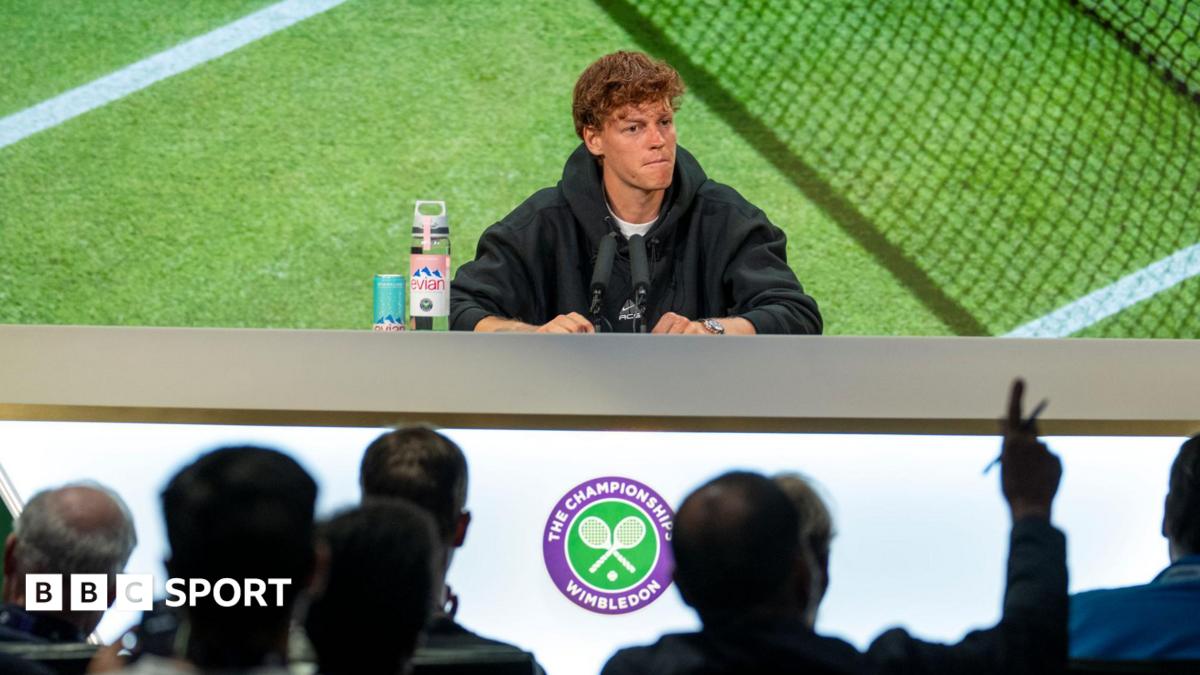 Jannik Sinner speaks at a news conference during the 2025 Wimbledon Championships