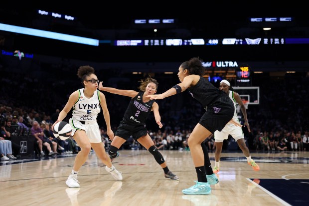 MINNEAPOLIS, MINNESOTA - JUNE 04: Olivia Miles #5 of the Minnesota Lynx dribbles while Kaitlyn Chen #2 and Janelle Salaun #13 of the Golden State Valkyries during the third quarter at Target Center on JUNE 04, 2026 in Minneapolis, Minnesota. NOTE TO USER: User expressly acknowledges and agrees that, by downloading and or using this photograph, User is consenting to the terms and conditions of the Getty Images License Agreement. (Photo by Ellen Schmidt/Getty Images)