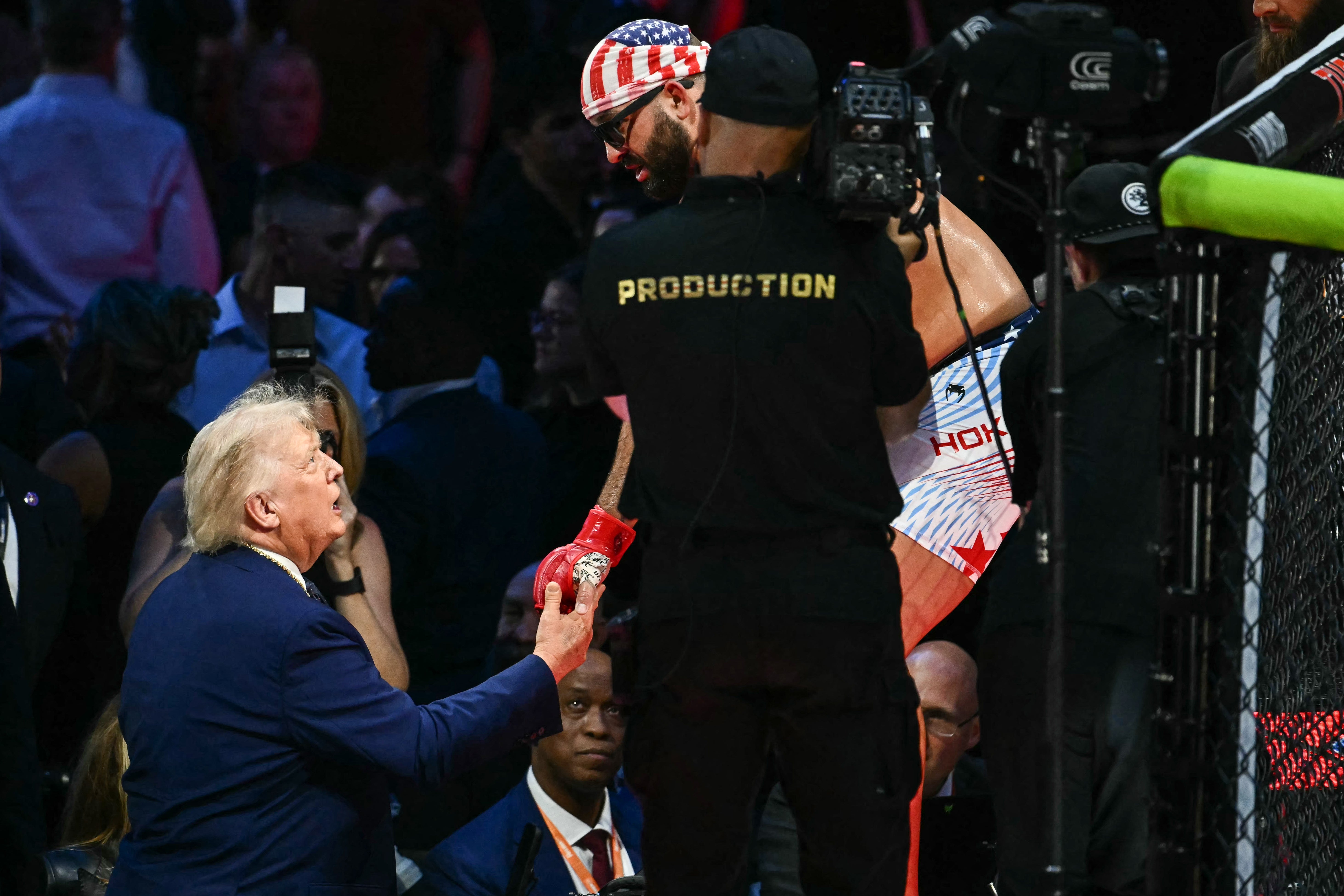 President Donald Trump shakes hands with America's Josh Hokit during the UFC Freedom 250