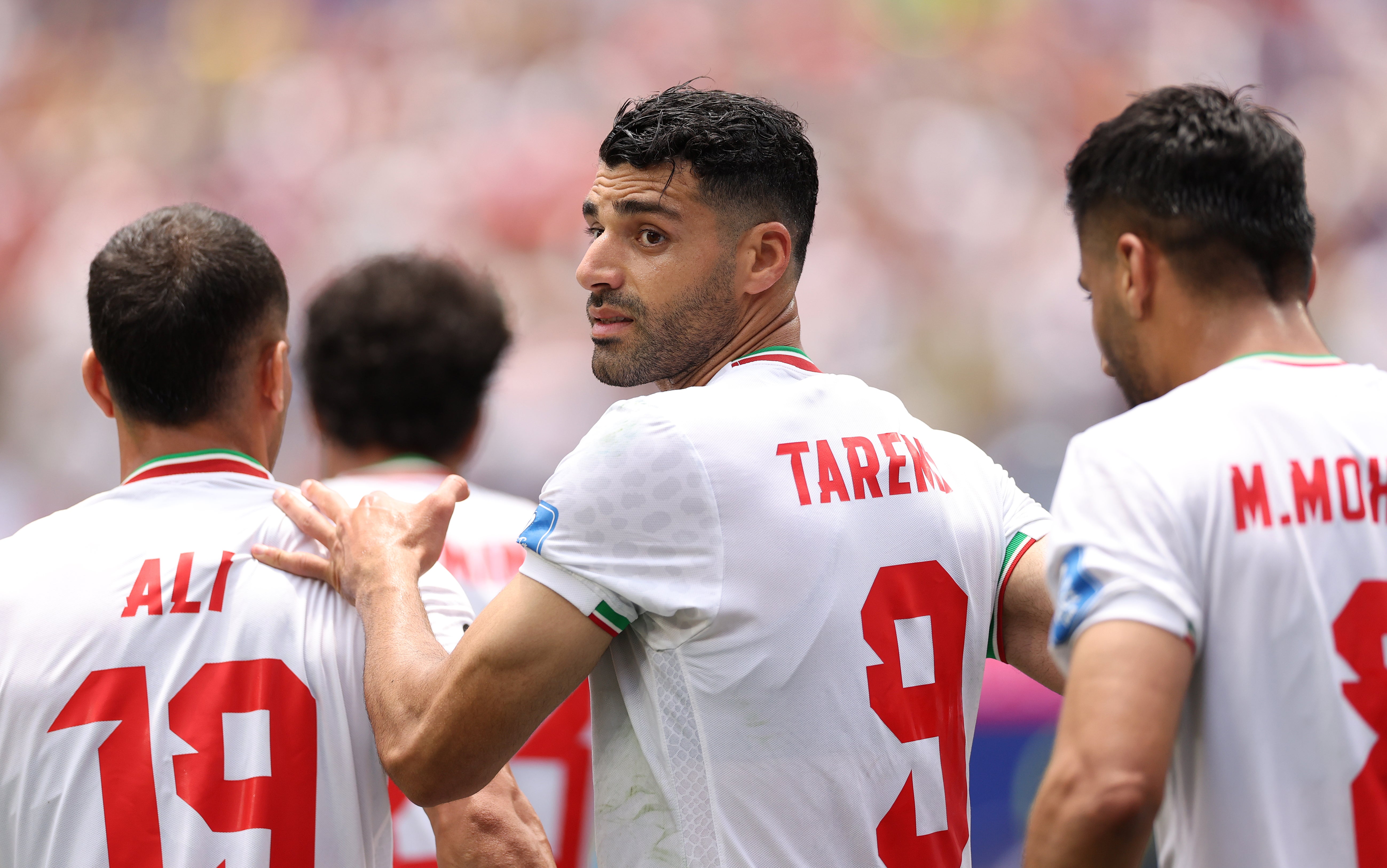 Mehdi Taremi #9 of IR Iran celebrates with team mates after scoring, only to have the goal disallowed, on Sunday