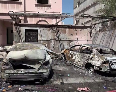 Damage to vehicles and buildings in Bahrain reportedly caused by debris from intercepted drones, from footage released by Bahrain TV on Thursday